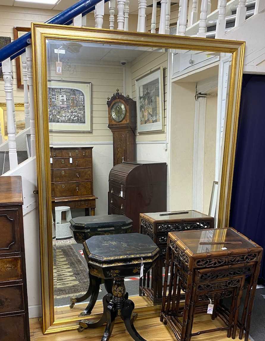 A large reproduction rectangular silvered and gilded mirror, width 140cm height 198cm